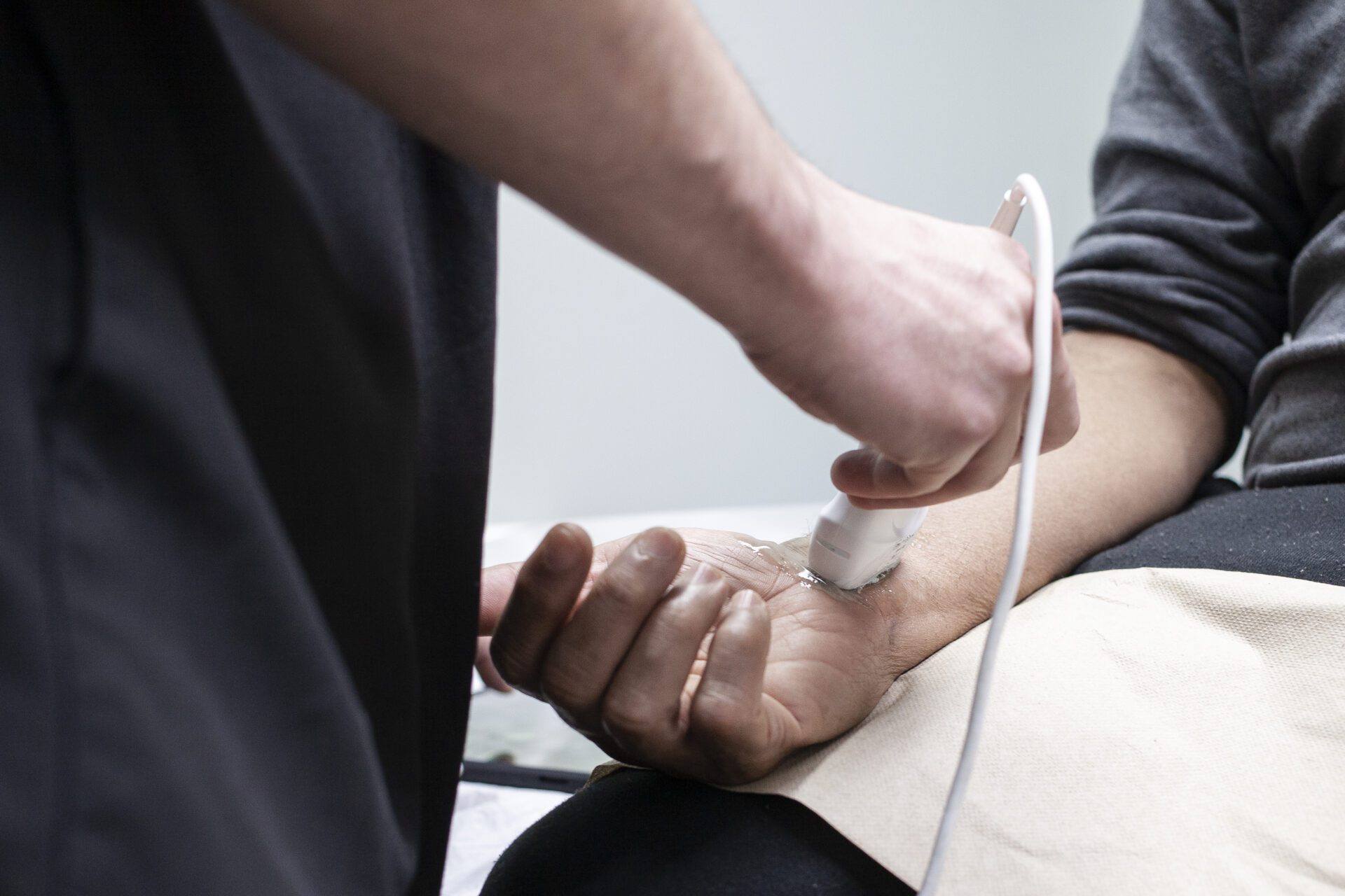 checking the patient hand with connected wire